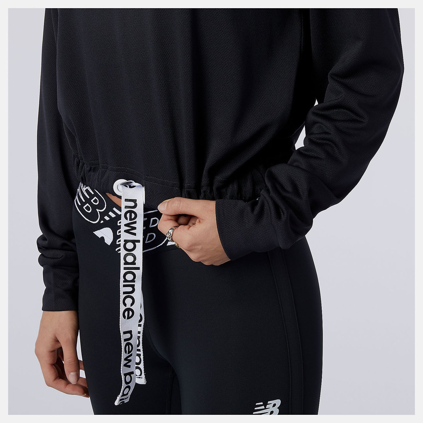 New Balance Relentless Cinched Hem Hoodie